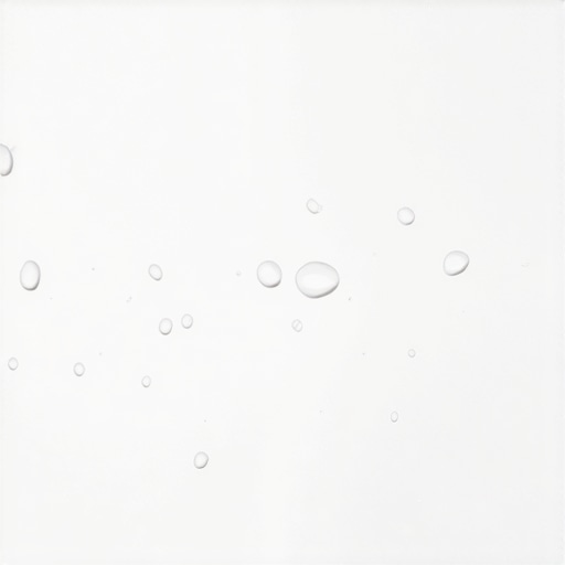 A perfectly clean and restored white porcelain sink showing water beads on the surface.
